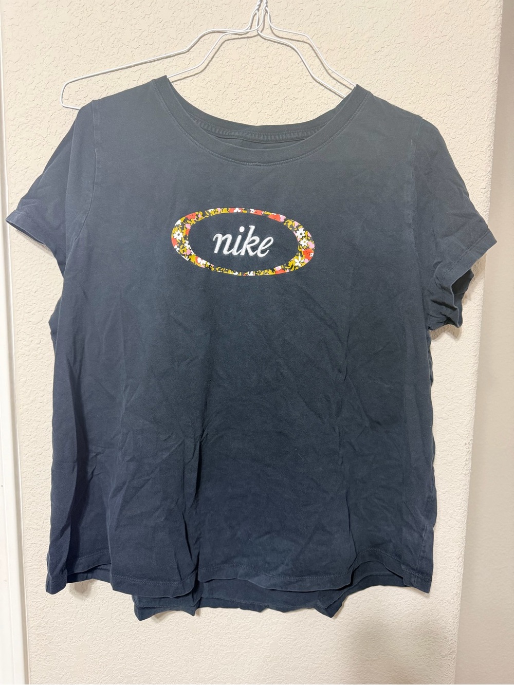 Nike Black Short-Sleeve Logo Tee with Floral Oval